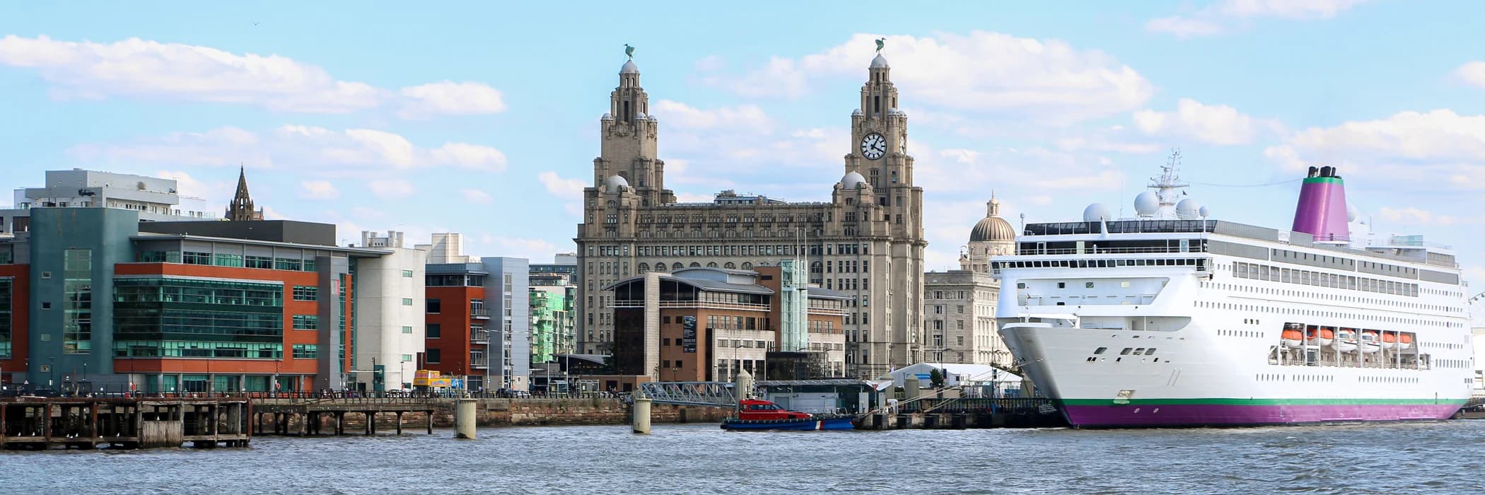 Cruise ship moored at Liverpool Cruise Terminal beside the Royal Liver Building