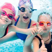 Kids In The Swimming Pool On Holiday